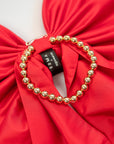 soma x agureeva, red bow, stiff taffeta, statement piece, necklace,  detachable ball chains, golden chain