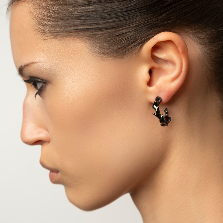 Mystic black stud earrings, sterling silver, rhodium plated, irregular shape,
second close-up