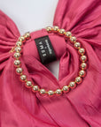 soma x agureeva, pink bow, stiff taffeta, statement piece, necklace,  detachable ball chains, golden chain