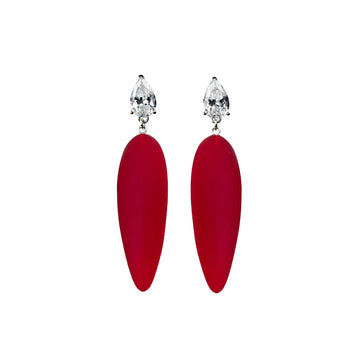 bright red rubber, large earrings , tear shaped white stone, white background.
