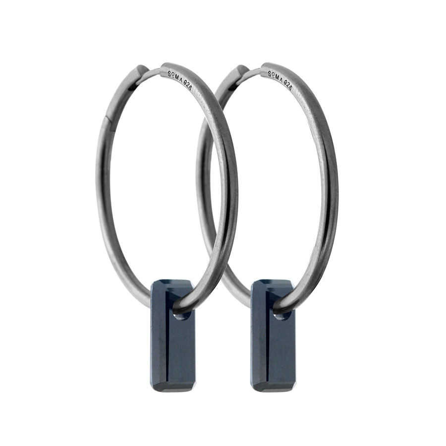 black silver earrings, large hoops, black stone trough hoops, white background.