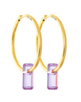 golden earrings, large hoops, stone trough hoops, white background.
