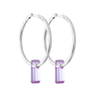 silver earrings, large hoops, lavender stone trough hoops, white background.