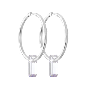 silver earrings, large hoops, stone trough hoops, white background.
