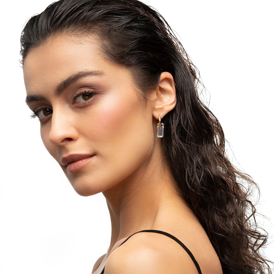 gold, hoop earrings, large white stone, hoop through stone, white background, close-up