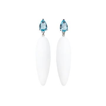 white rubber, large earrings , drop shaped blue stone, white background.