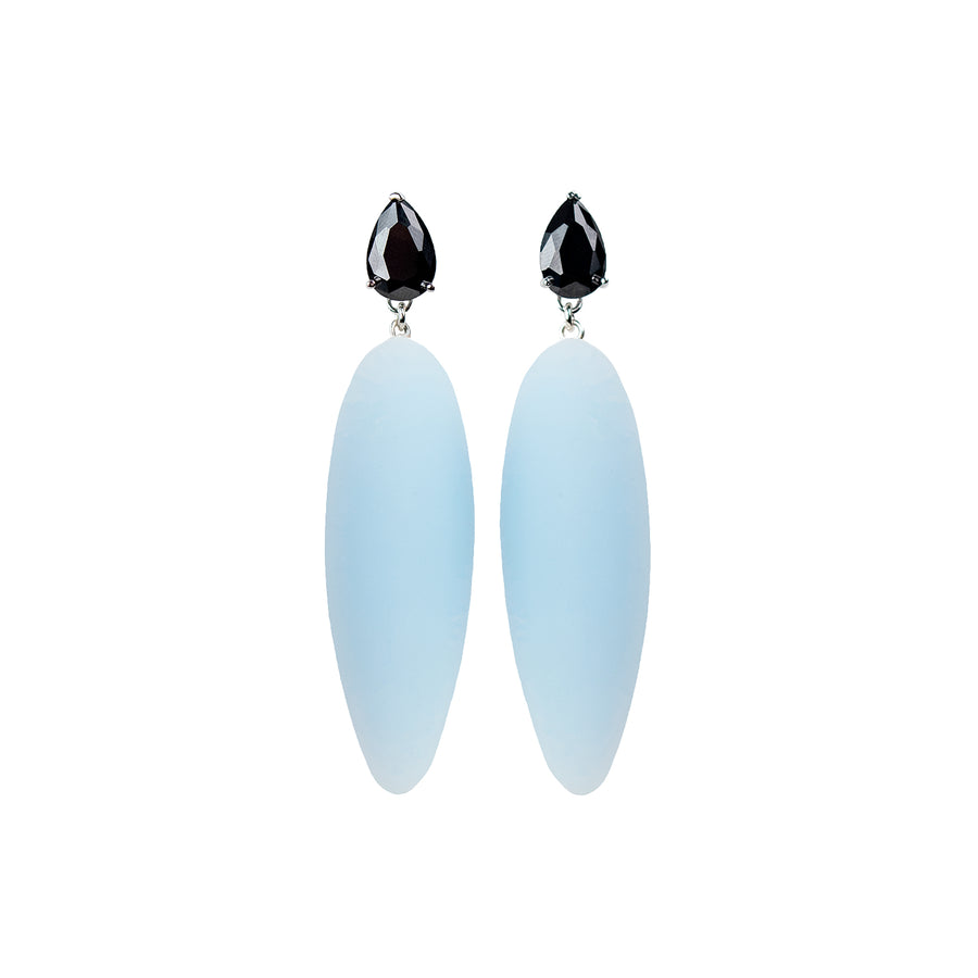light blue rubber, large earrings , tear shaped black stone, white background.