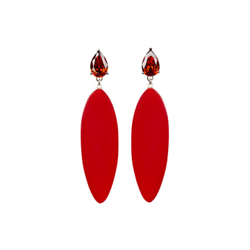 bright red rubber, large earrings , tear shaped red stone, white background.