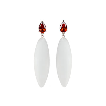 transparent rubber, large earrings , tear shaped red stone, white background.