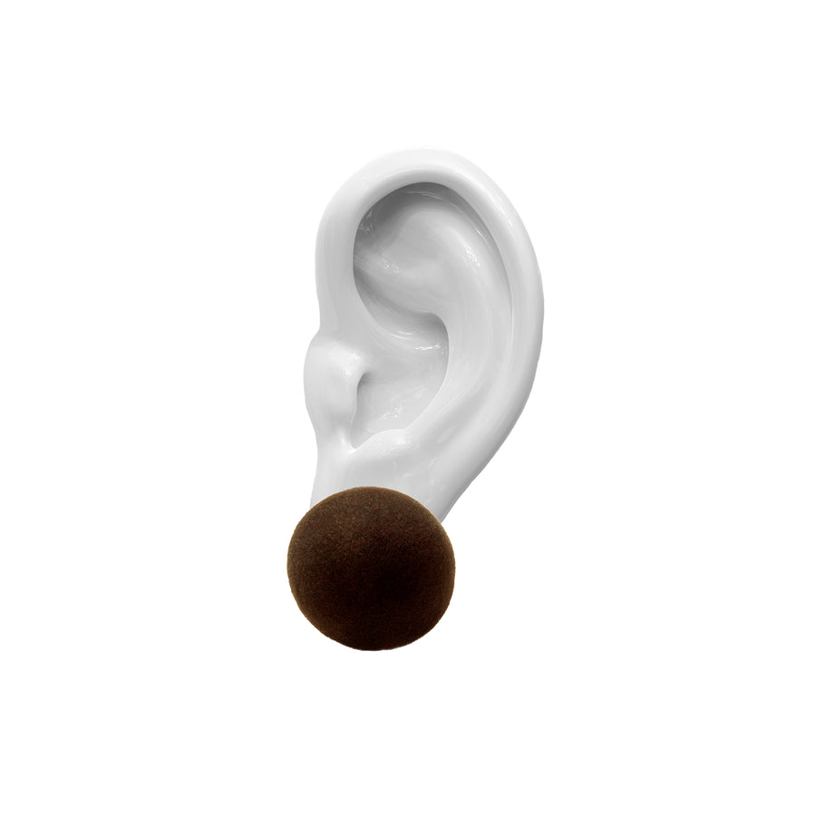 porcelain ear,  brown velvet earring, on top, white background.
